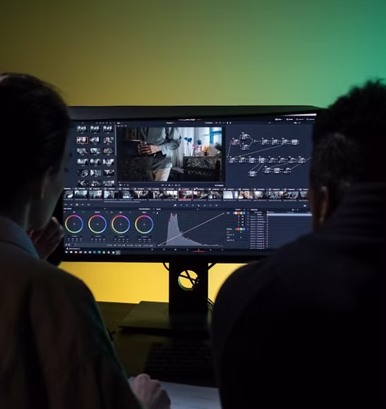 A post-production team working together in a colour grading suite